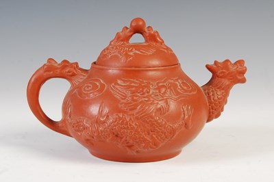 Lot 196 - A Chinese Yixing pottery tea pot and cover,...