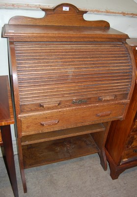 Lot 626 - An early 20th century oak roll-top desk with...