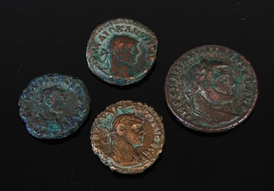 Lot 229 - Four antique Roman coins, the largest...