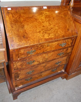 Lot 627 - A George III style reproduction walnut bureau,...