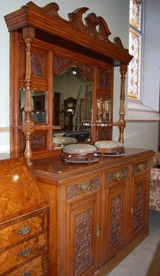 Lot 628 - A carved oak mirror-back sideboard, the back...