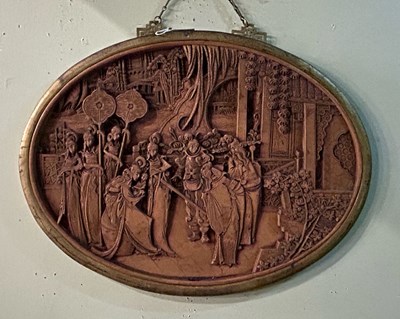 Lot 561 - A Chinese carved wood oval wall hanging,...