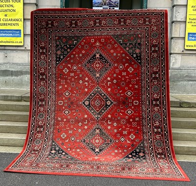 Lot 769 - A machine made Afghan wool carpet,...