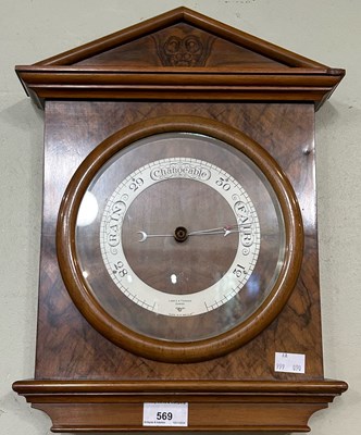 Lot 569 - An early 20th century walnut barometer, Lennie...