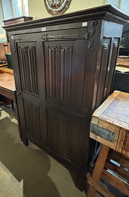 Lot 607 - An antique stained oak cupboard with single...