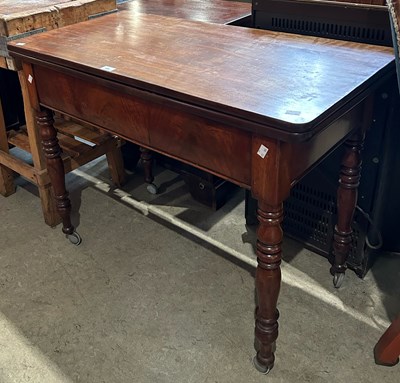 Lot 609 - A 19th century mahogany foldover tea table on...