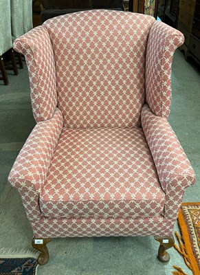 Lot 652 - An early 20th century mahogany wing armchair,...