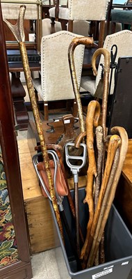 Lot 654 - Two vintage shooting sticks together with a...