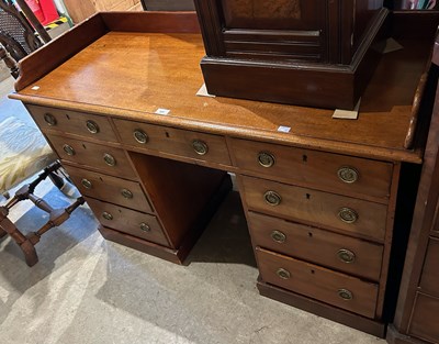 Lot 666 - A late 19th century mahogany kneehole desk,...