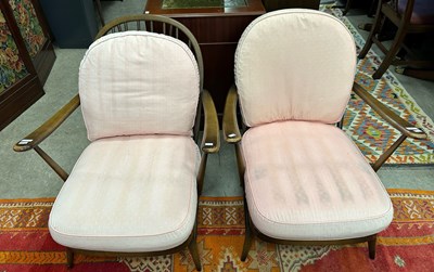 Lot 677 - A pair of Ercol spindle back armchairs with...