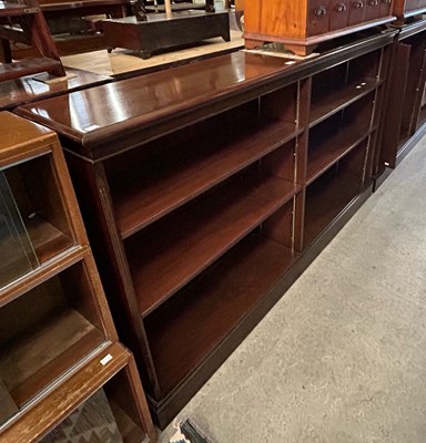 Lot 680 - A pair of mahogany open bookcases with various...