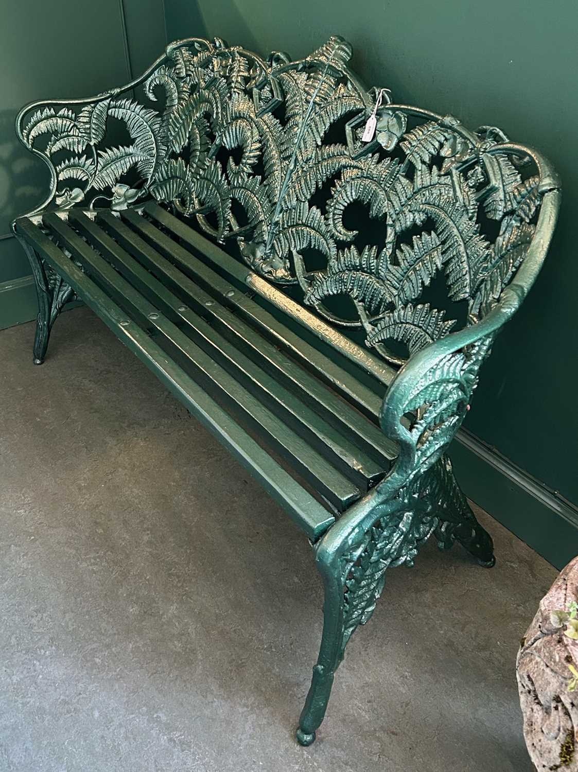 Lot 686 - An antique cast iron fern pattern garden bench,...