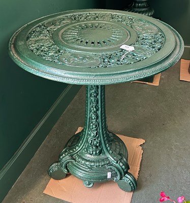 Lot 688 - A later green painted cast iron garden table,...