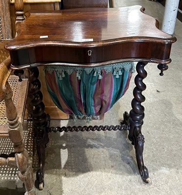 Lot 692 - A 19th century rosewood work table, the...