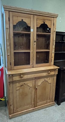 Lot 691 - A pine dresser/bookcase, fitted with two...