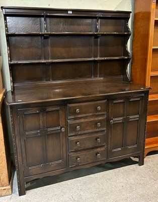 Lot 709 - An Ercol dining room suite comprising dresser,...