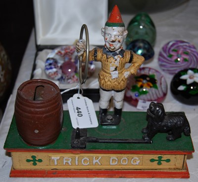 Lot 440 - A cast iron "trick dog" money bank with later...