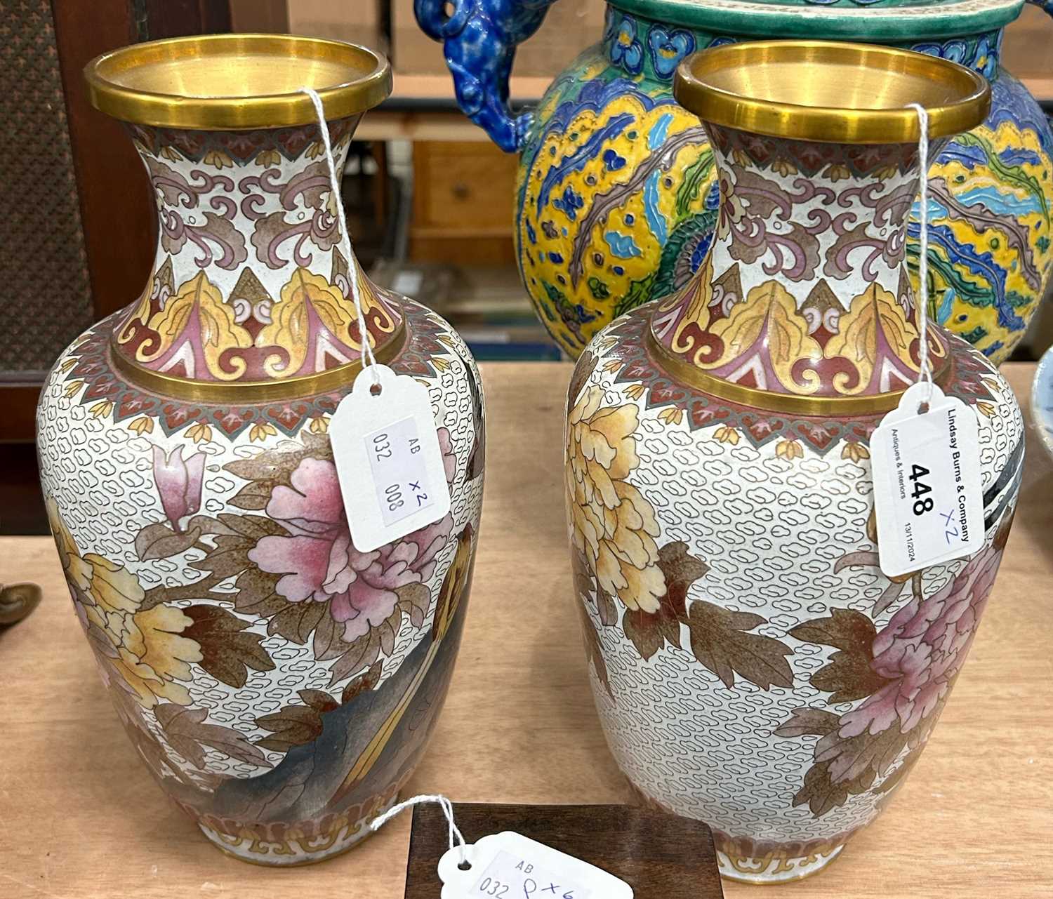 Lot 448 - A pair of Chinese white ground cloisonne vases...