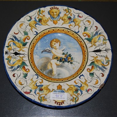 Lot 196A - A Majolica pottery plate decorated with cherub,...