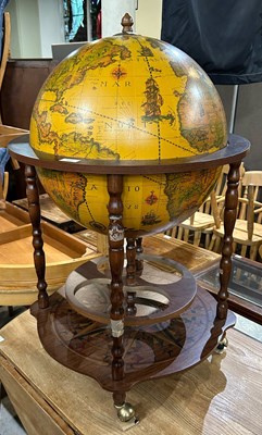 Lot 737 - A globe form drinks trolley, approximately...