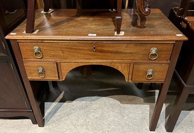 Lot 752 - A George III style mahogany lowboy, the...