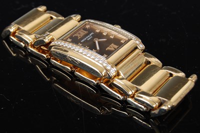 Lot 638 - A ladies 18ct gold and diamond set Patek...