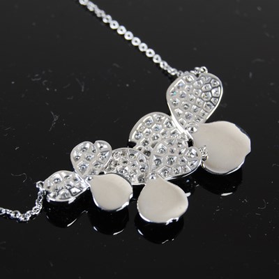 Lot 745 - Tiffany & Co., a platinum and diamond Paper...