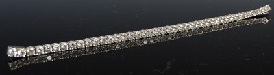 Lot 758 - An 18ct white gold and diamond tennis bracelet,...