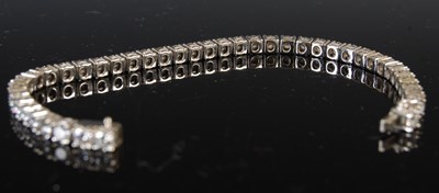 Lot 758 - An 18ct white gold and diamond tennis bracelet,...