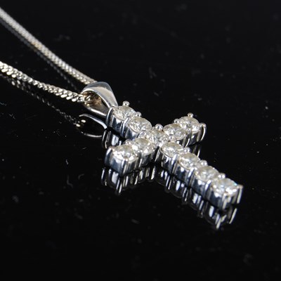 Lot 746 - An 18ct white gold and diamond cross pendant...