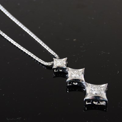 Lot 721 - An 18ct white gold and diamond pendant...