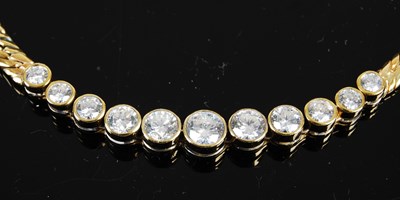 Lot 752 - An 18ct gold and diamond necklace, centred...