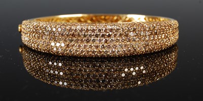 Lot 753 - A yellow metal and diamond pavé set hinged...