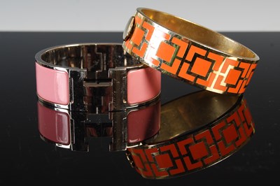 Lot 682 - Hermes, a white metal and pink enamel 'H'...