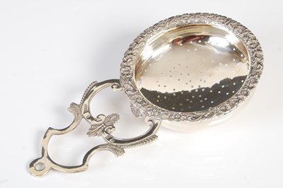 Lot 503 - A George IV Scottish silver punch strainer, by...