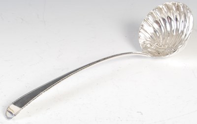 Lot 557 - A George III small soup or punch ladle, by...