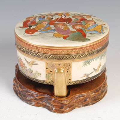 Lot 853 - A Japanese Satsuma pottery box and cover,...