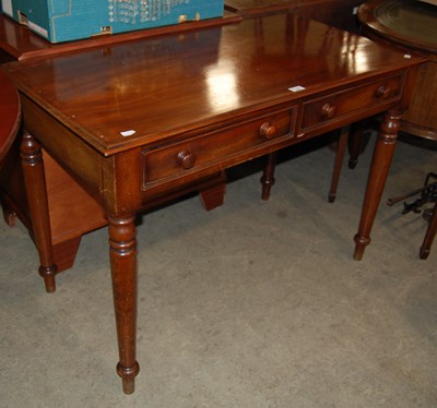 Lot 662 - A 19th century mahogany side table with two...