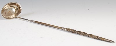 Lot 499 - An antique silver toddy ladle, marks rubbed,...