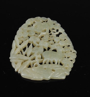 Lot 50 - A Chinese jade oval-shaped plaque, carved and...