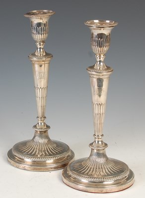 Lot 521 - A pair of George III silver candlesticks,...