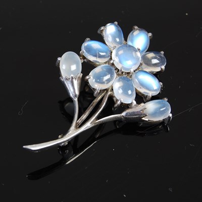 Lot 675 - A silver and moonstone floral spray...