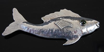 Lot 647 - A silver brooch formed as a fish, with...