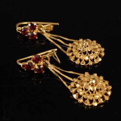 Lot 710 - A pair of Indian high carat gold and garnet...