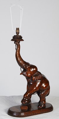 Lot 146 - A 20th century carved wood elephant table lamp...