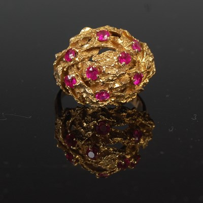 Lot 667 - A vintage 9ct gold and ruby dress ring, set...