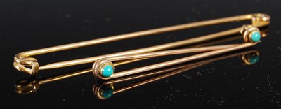 Lot 693 - An oversized yellow metal safety pin,...