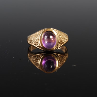 Lot 671 - A 9ct gold and amethyst cabochon single stone...