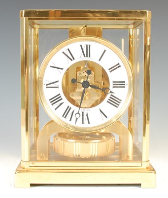 Lot 233 - A Jaeger-LeCoultre brass cased Atmos clock,...