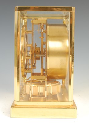 Lot 233 - A Jaeger-LeCoultre brass cased Atmos clock,...